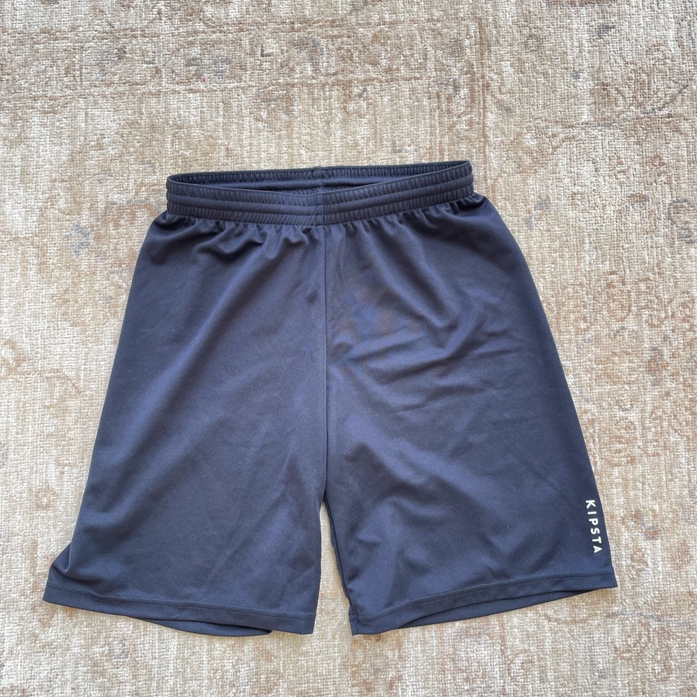 Kipsta black athletic shorts size youth small.